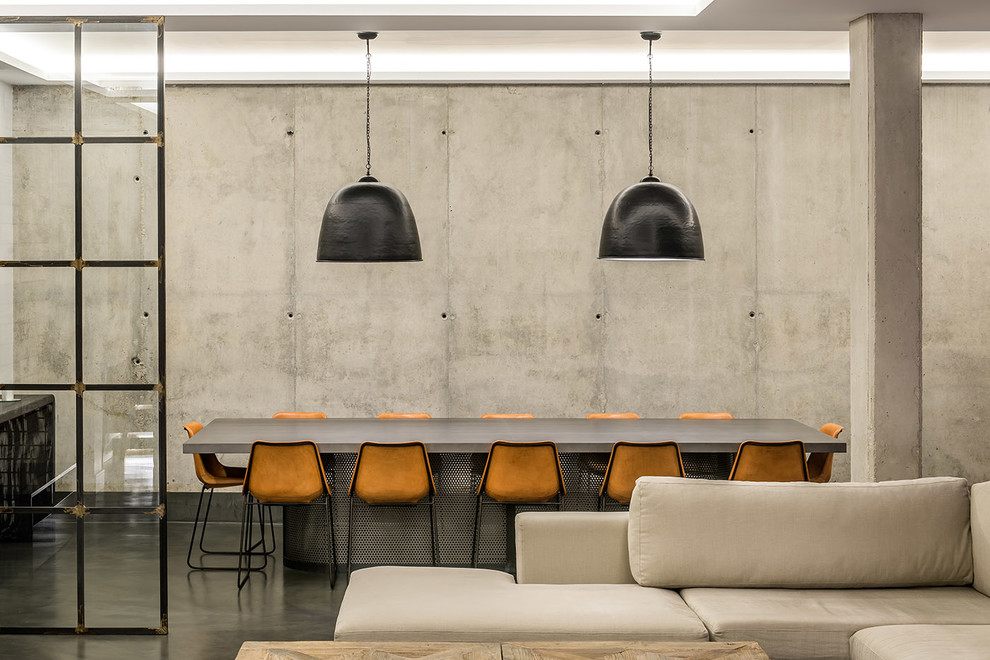 This is an example of a large contemporary open plan dining room in Madrid with grey walls and no fireplace.