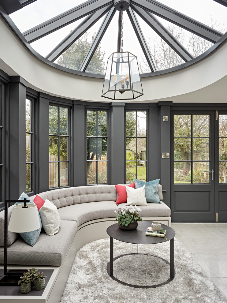Inspiration for a traditional conservatory in London with a glass ceiling and beige floors.