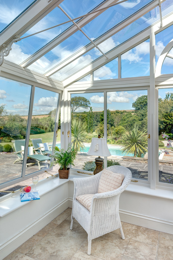 Inspiration for a large traditional conservatory in Devon with ceramic flooring and a glass ceiling.