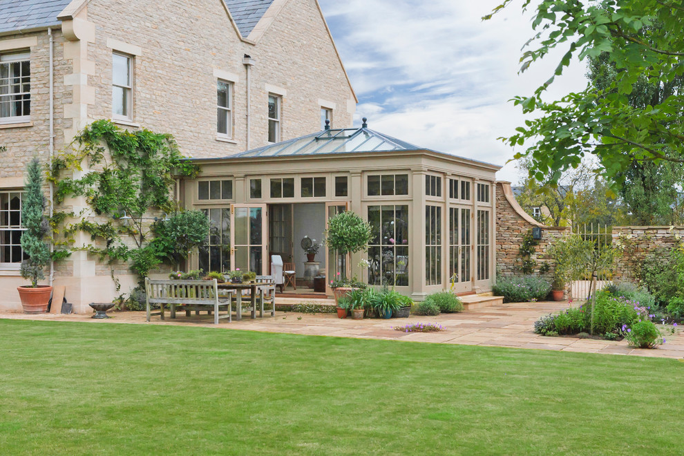 This is an example of a large traditional conservatory in Other with no fireplace and a glass ceiling.