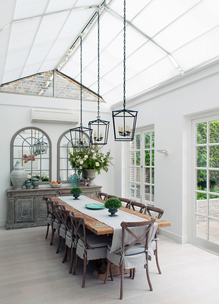 Example of a mid-sized cottage gray floor and light wood floor sunroom design in London with no fireplace and a glass ceiling