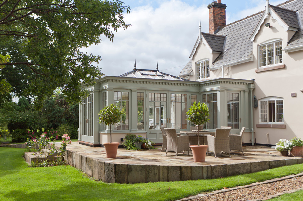 Large classic conservatory in Other with limestone flooring, no fireplace and a glass ceiling.