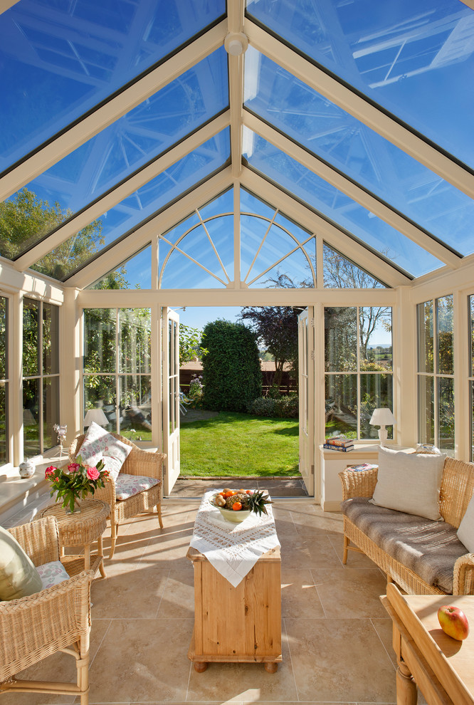 Design ideas for a large classic conservatory in Other with travertine flooring, a glass ceiling and beige floors.
