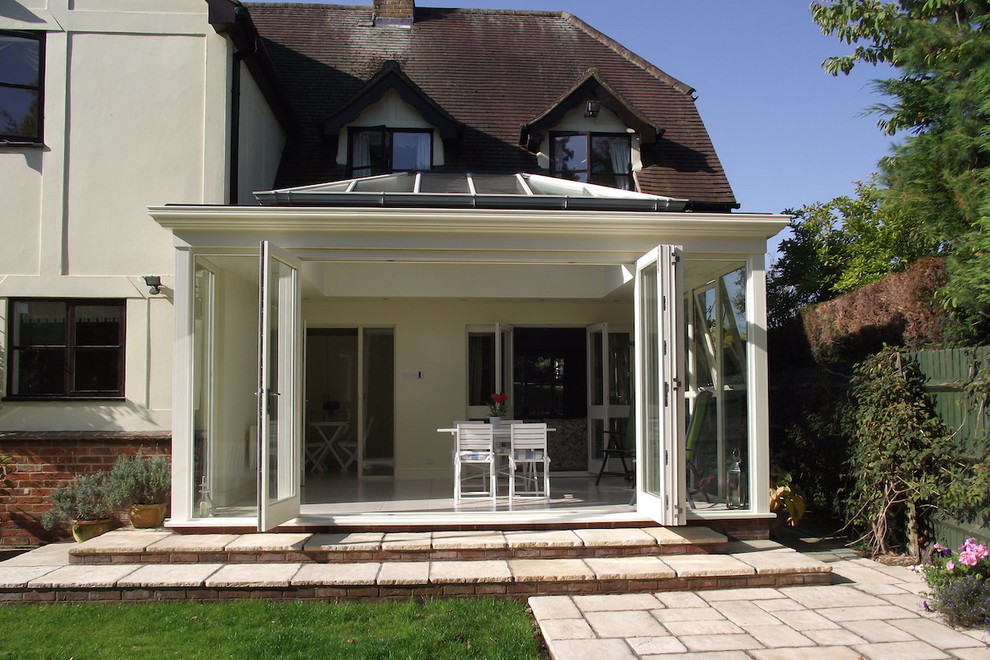 Inspiration for a medium sized contemporary conservatory in Cambridgeshire with ceramic flooring, a glass ceiling and beige floors.