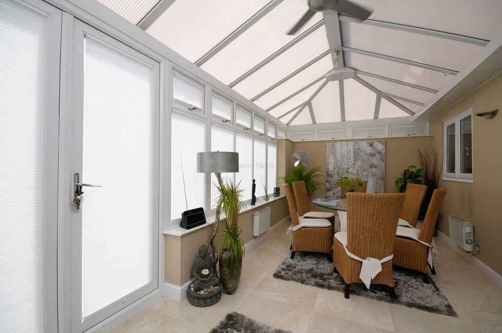 Inspiration for a medium sized contemporary conservatory in Surrey with a glass ceiling.
