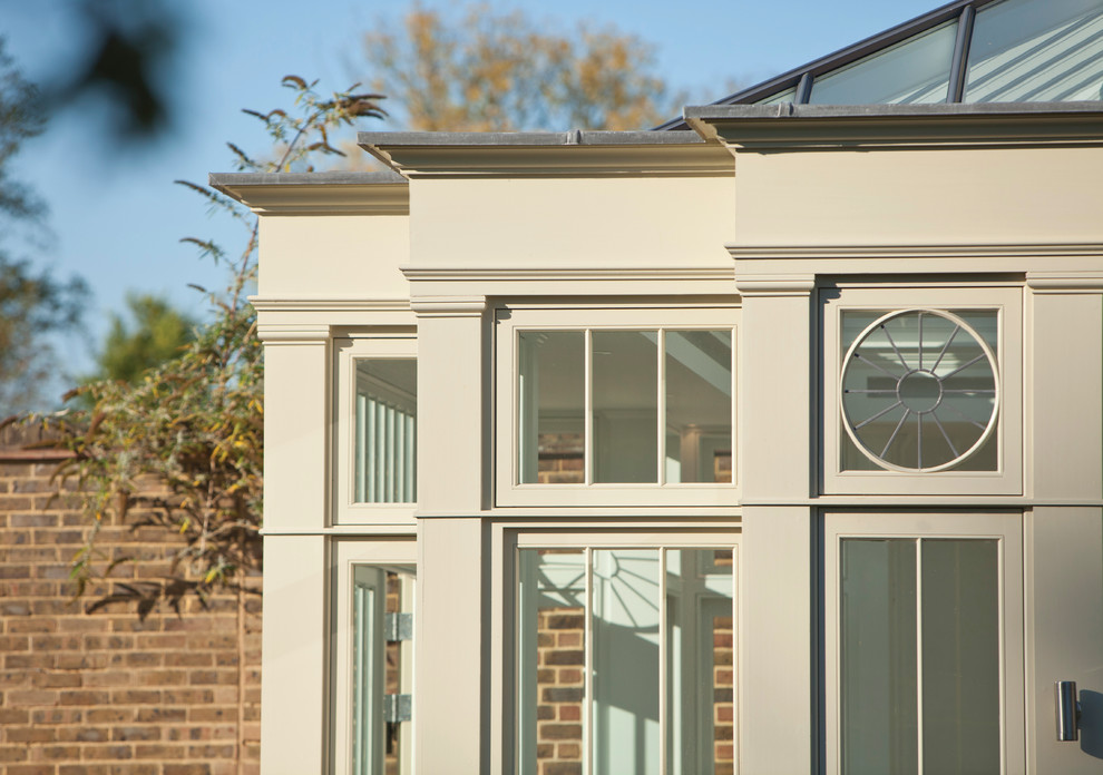 This is an example of a large contemporary conservatory in Essex with a glass ceiling.