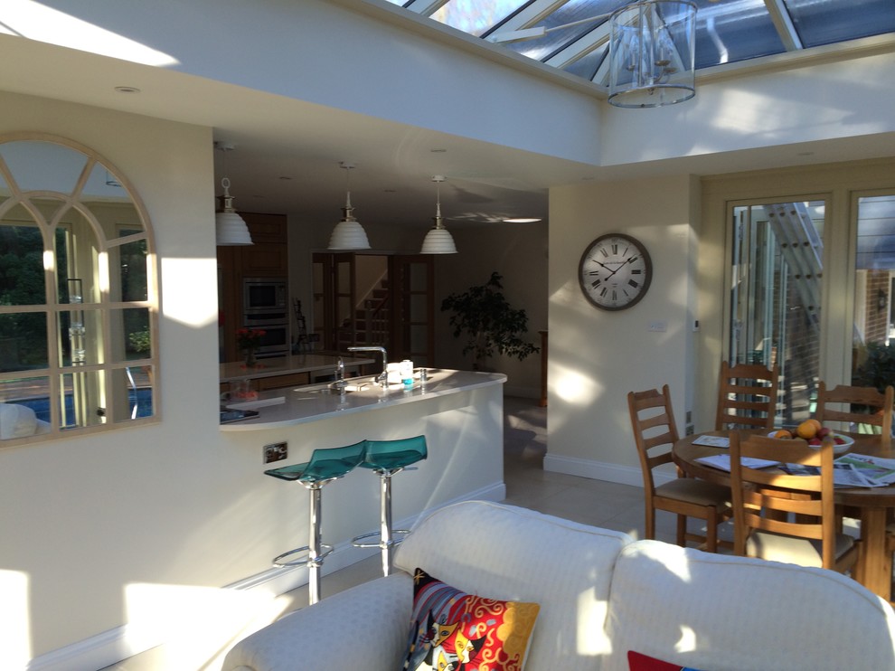 This is an example of a large contemporary conservatory in Surrey.