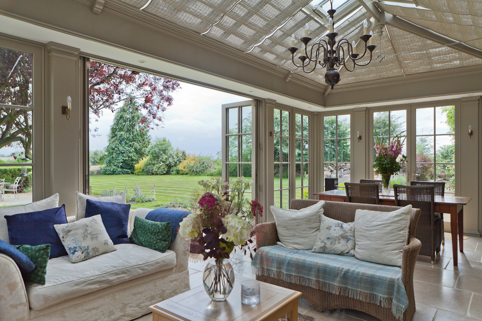 Photo of a large traditional conservatory in Other with limestone flooring, no fireplace and a glass ceiling.