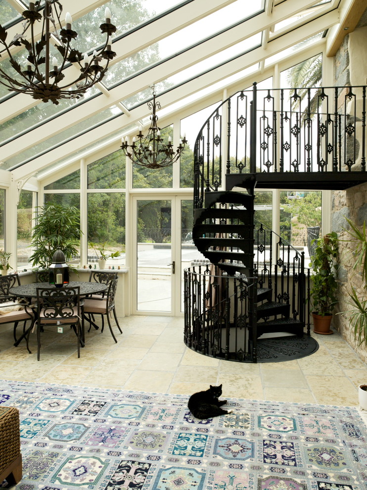 Design ideas for a rural conservatory in Channel Islands with a glass ceiling and beige floors.