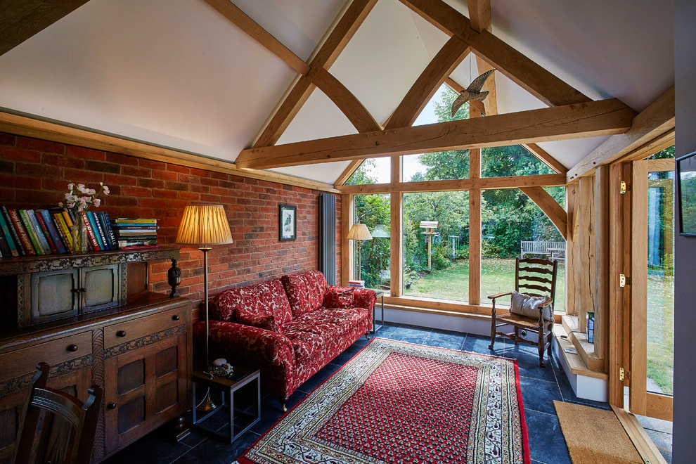 Photo of a medium sized rural conservatory in Berkshire with a standard ceiling and blue floors.