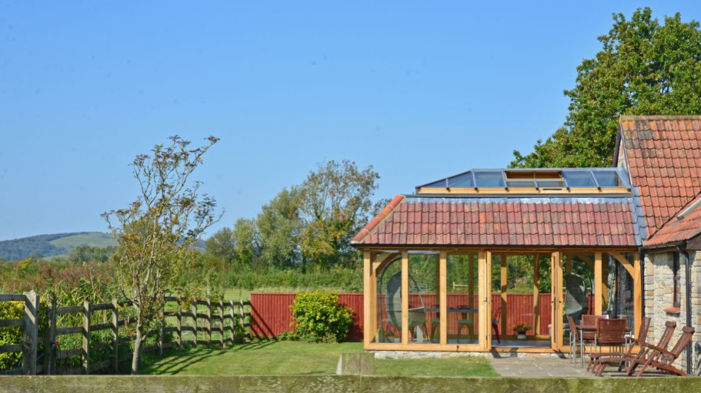 Esempio di una veranda stile rurale di medie dimensioni