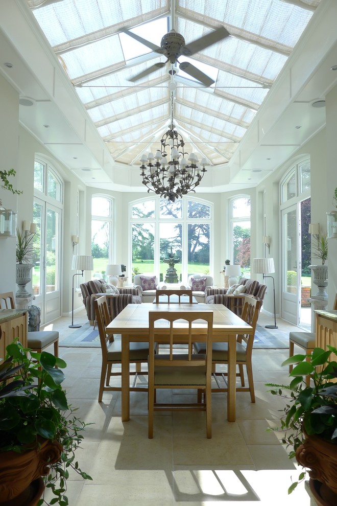 Photo of a large traditional conservatory in London with no fireplace and a glass ceiling.