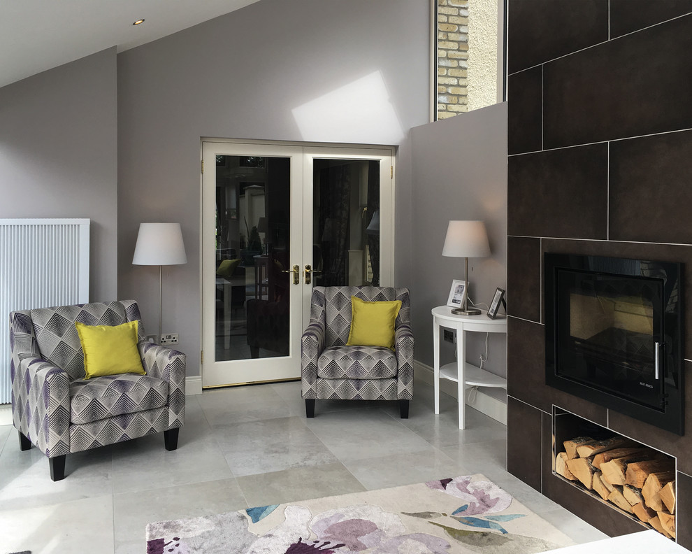 Small trendy porcelain tile and beige floor sunroom photo in Other with a standard fireplace, a tile fireplace and a standard ceiling