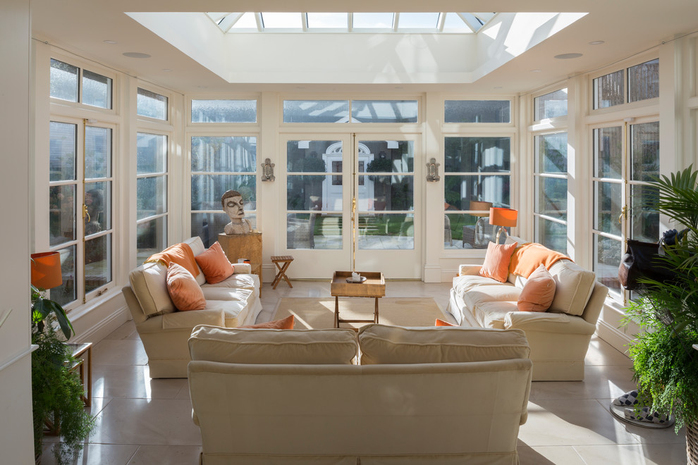 Design ideas for a large traditional conservatory in Dublin with marble flooring, a skylight and beige floors.