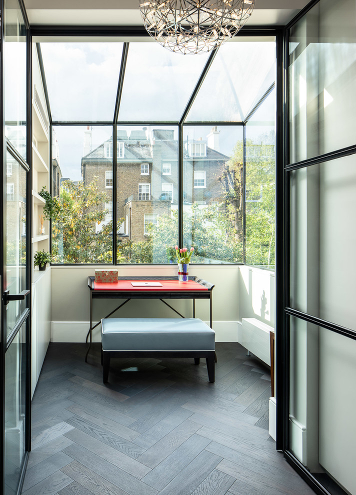 Example of a trendy sunroom design in London