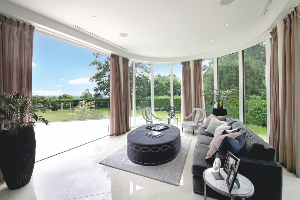 This is an example of a traditional conservatory in Surrey with no fireplace and a standard ceiling.