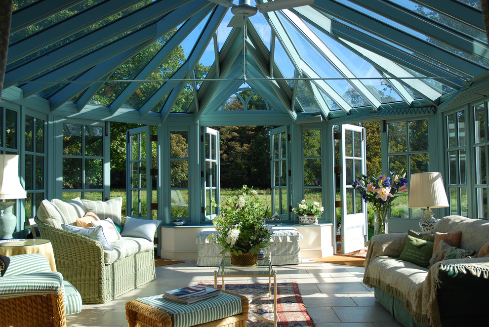 Design ideas for a victorian conservatory in Other with travertine flooring and a glass ceiling.