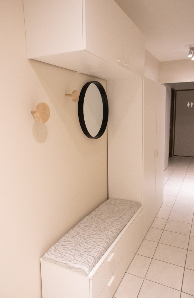 Hallway - mid-sized scandinavian ceramic tile and white floor hallway idea in Lyon with beige walls