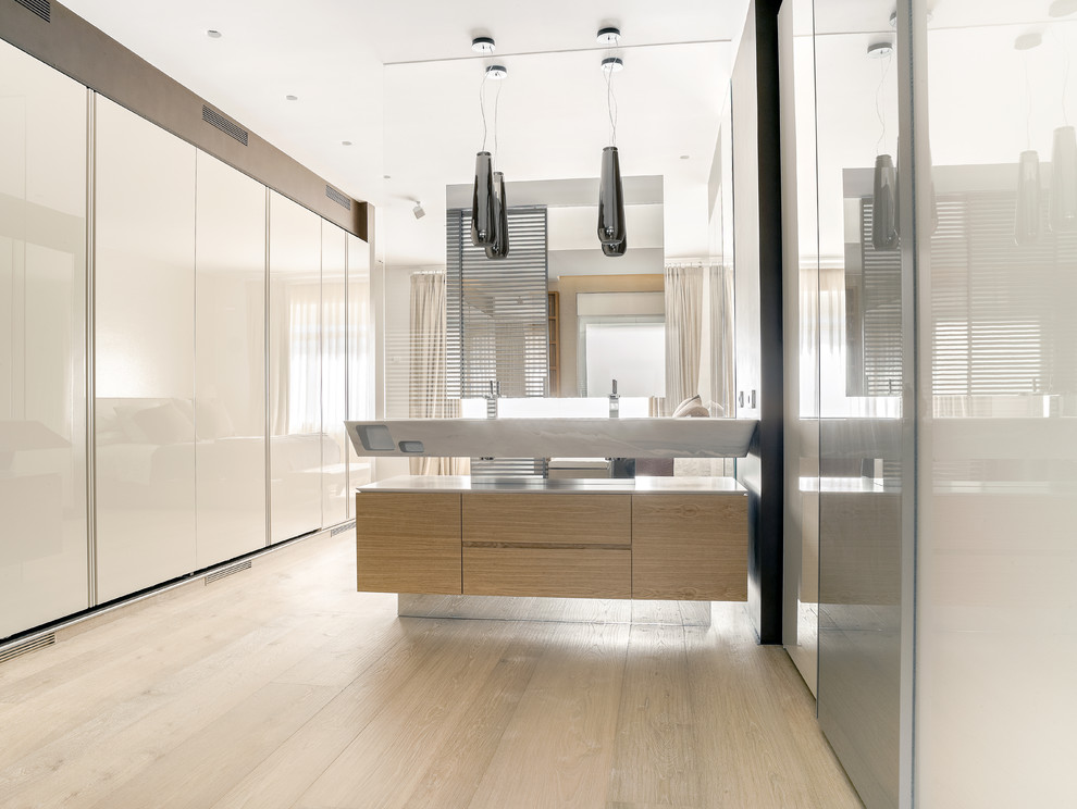 Photo of a large contemporary shower room bathroom in Madrid with flat-panel cabinets, medium wood cabinets, a vessel sink, white walls and light hardwood flooring.