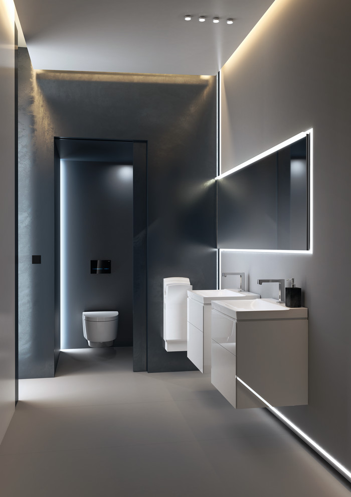 Immagine di una stanza da bagno minimal con WC sospeso e lavabo sospeso