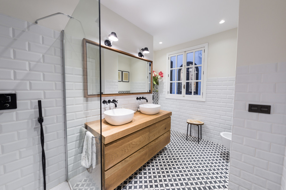 Photo of a medium sized contemporary shower room bathroom in Alicante-Costa Blanca with flat-panel cabinets, a walk-in shower, a two-piece toilet, white tiles, ceramic tiles, white walls, terracotta flooring, a wall-mounted sink, wooden worktops, black floors and an open shower.
