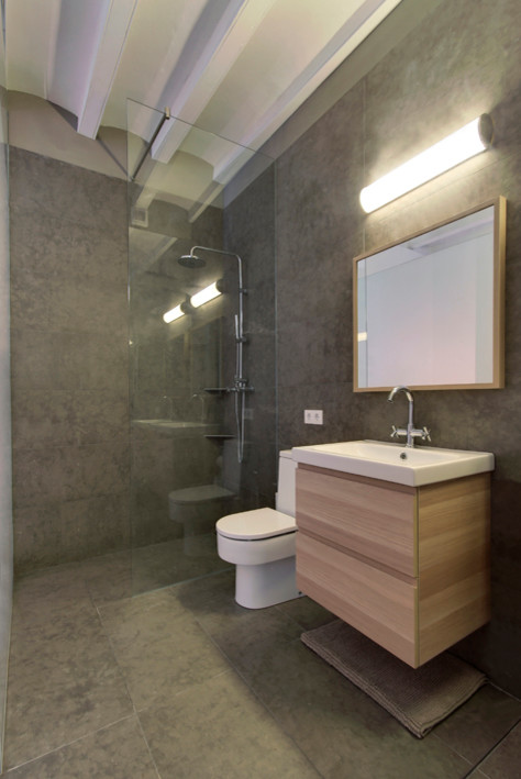 Inspiration for a medium sized contemporary shower room bathroom in Other with freestanding cabinets, medium wood cabinets, a built-in shower, a two-piece toilet, grey walls, ceramic flooring and an integrated sink.