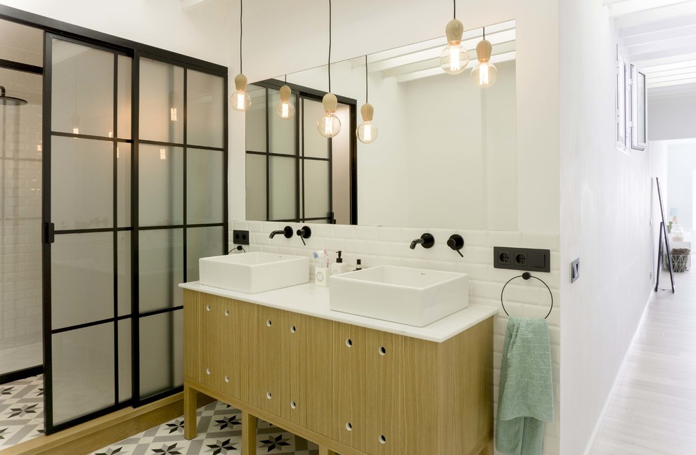 Inspiration for a large scandinavian master white tile and ceramic tile porcelain tile and multicolored floor bathroom remodel in Malaga with furniture-like cabinets, medium tone wood cabinets, a one-piece toilet, white walls, a vessel sink and quartz countertops