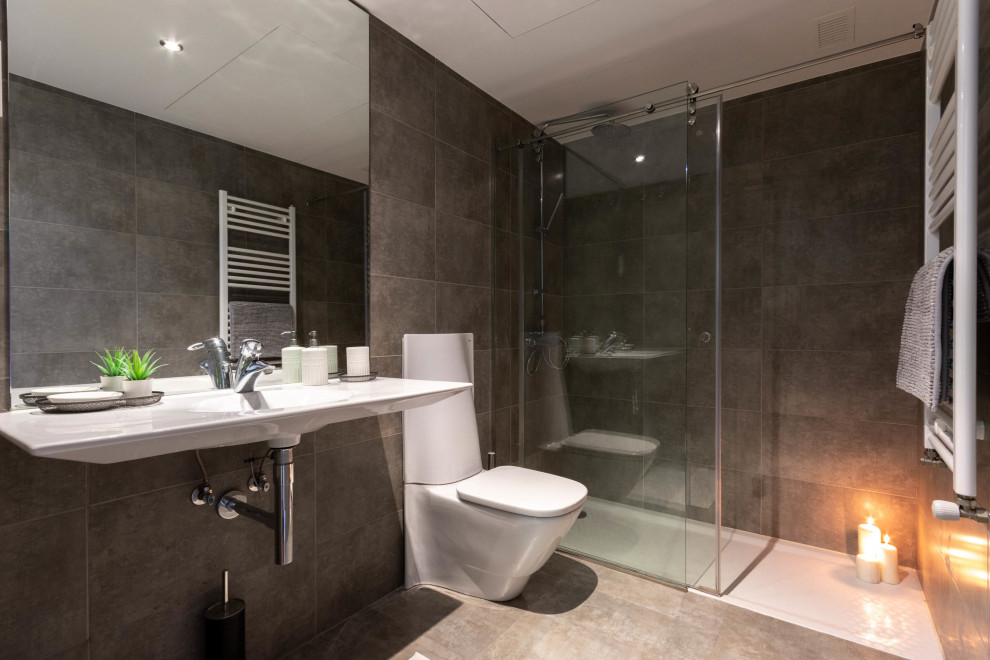 Inspiration for a medium sized contemporary grey and white bathroom in Other with a corner shower, a one-piece toilet, grey tiles, porcelain tiles, porcelain flooring, a wall-mounted sink, grey floors, a hinged door and a single sink.