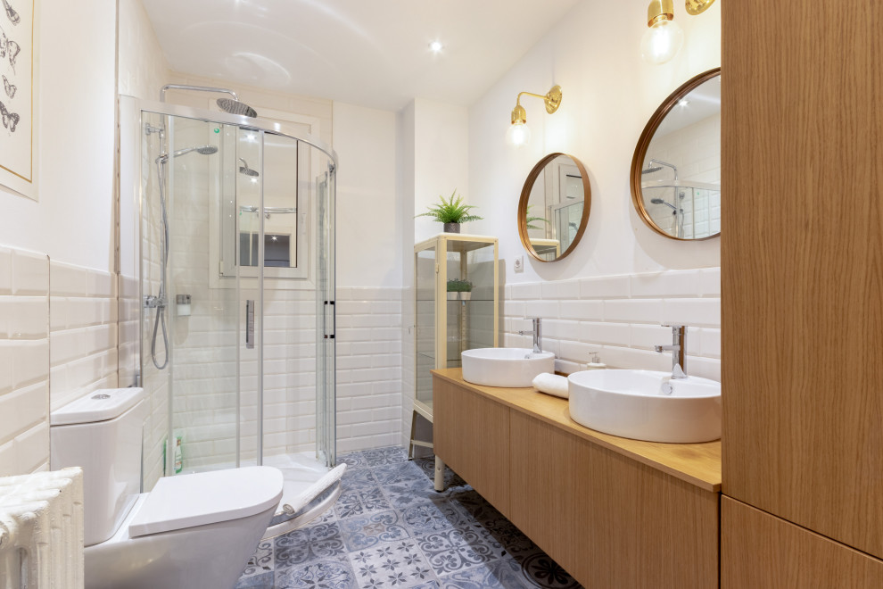 Medium sized contemporary bathroom in Other with flat-panel cabinets, medium wood cabinets, a corner shower, white tiles, metro tiles, white walls, a vessel sink, wooden worktops, blue floors, a hinged door, beige worktops, double sinks and a floating vanity unit.