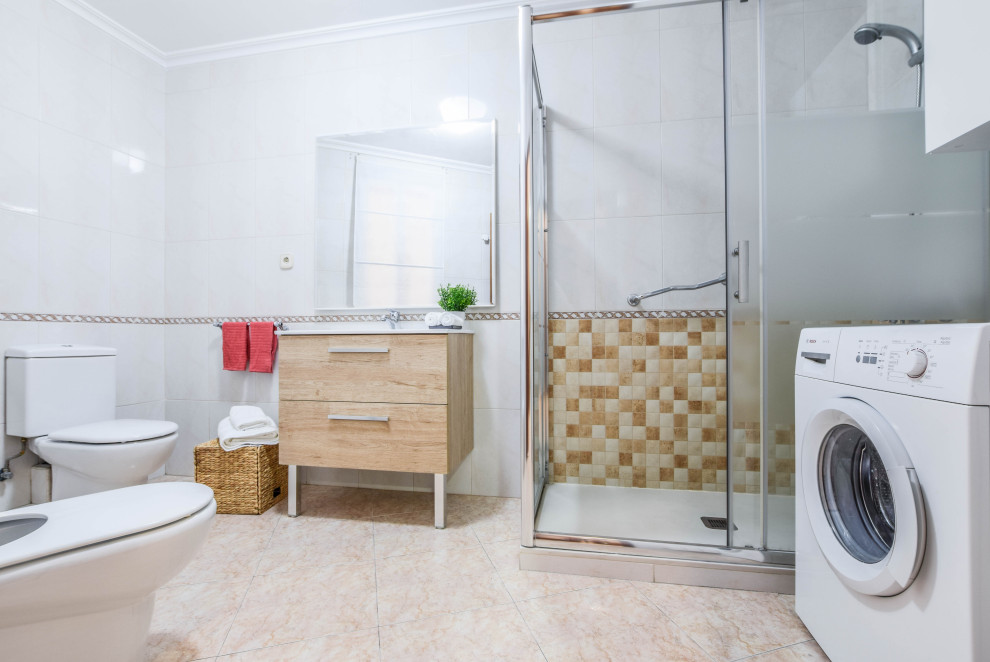 This is an example of a medium sized traditional ensuite bathroom in Madrid with freestanding cabinets, a corner shower, a bidet, white tiles, white walls, ceramic flooring, a trough sink, beige floors and a sliding door.