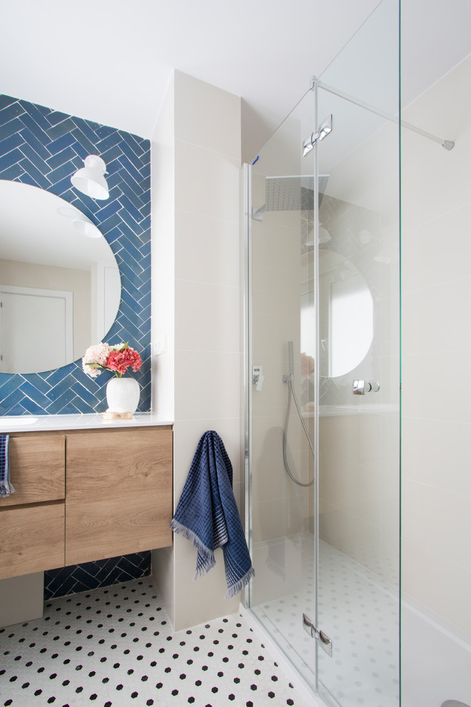 Design ideas for a medium sized scandinavian bathroom in Madrid with blue tiles and white tiles.