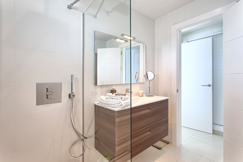 Inspiration for a small scandinavian shower room bathroom in Malaga with freestanding cabinets, medium wood cabinets, white walls, ceramic flooring and an integrated sink.