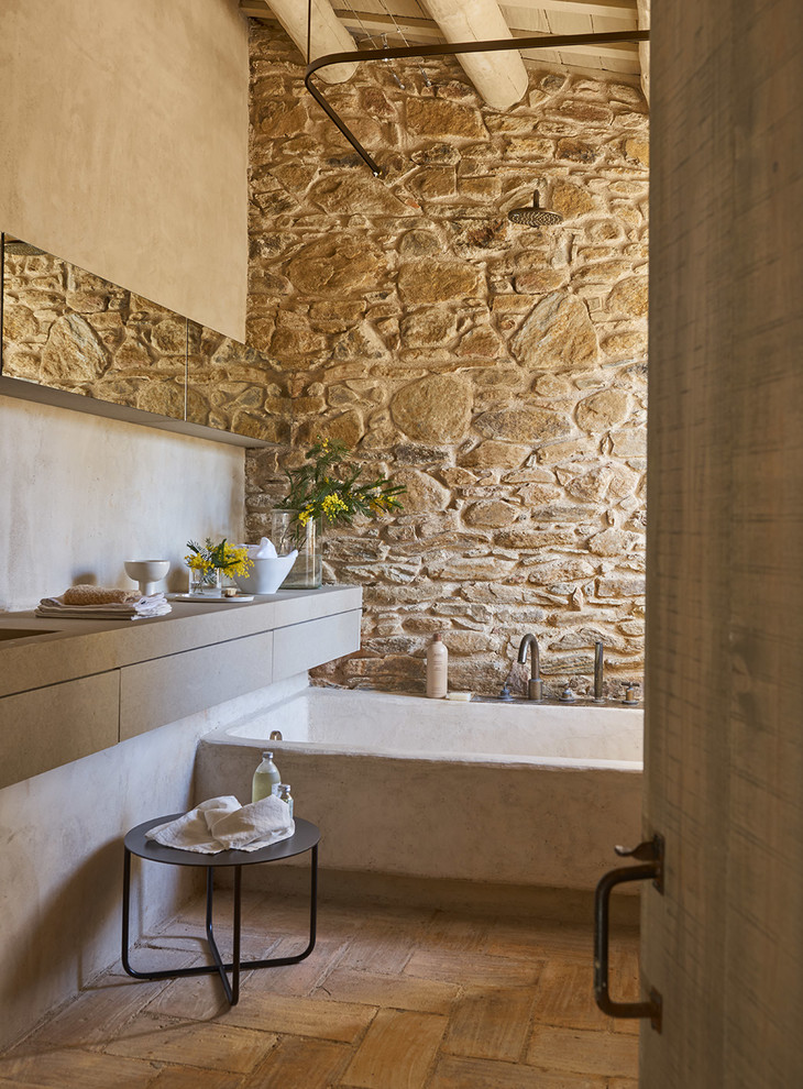 Mediterranean bathroom in Barcelona with an alcove bath.