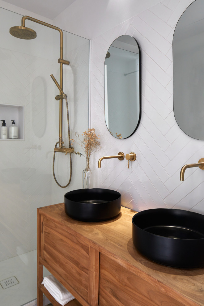 Photo of a medium sized contemporary shower room bathroom in Other with medium wood cabinets, an alcove shower, white tiles, a vessel sink, wooden worktops, an open shower, brown worktops, a wall niche, double sinks, a freestanding vanity unit and flat-panel cabinets.
