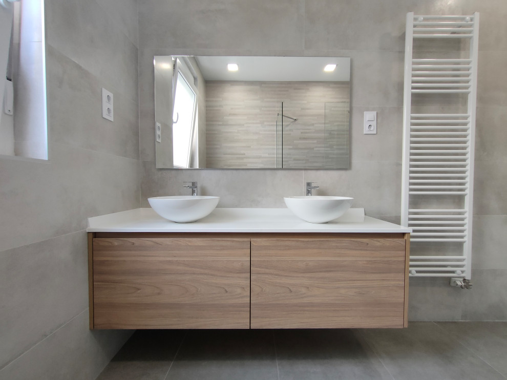 Inspiration for a large contemporary ensuite wet room bathroom in Other with flat-panel cabinets, white cabinets, a wall mounted toilet, beige tiles, ceramic tiles, beige walls, ceramic flooring, a vessel sink, engineered stone worktops, beige floors, an open shower, white worktops, an enclosed toilet, double sinks and a floating vanity unit.