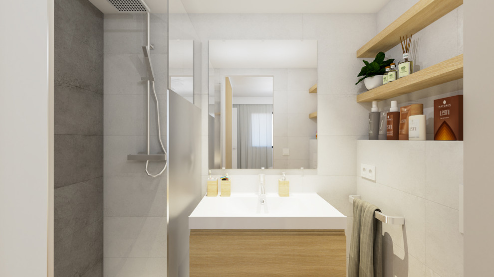 This is an example of a small scandinavian ensuite bathroom in Seville with freestanding cabinets, light wood cabinets, an alcove shower, a wall mounted toilet, black and white tiles, ceramic tiles, white walls, porcelain flooring, an integrated sink, solid surface worktops, brown floors and a hinged door.
