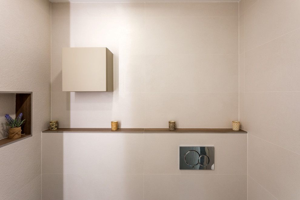Bathroom - small porcelain tile and brown floor bathroom idea in Valencia with a bidet and an undermount sink