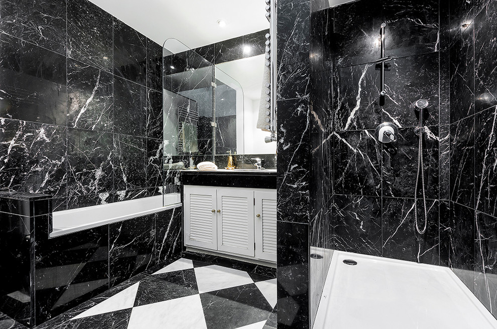 Inspiration for a medium sized traditional ensuite bathroom in Madrid with raised-panel cabinets, white cabinets, an alcove bath, a shower/bath combination, black and white tiles, black walls and a built-in sink.