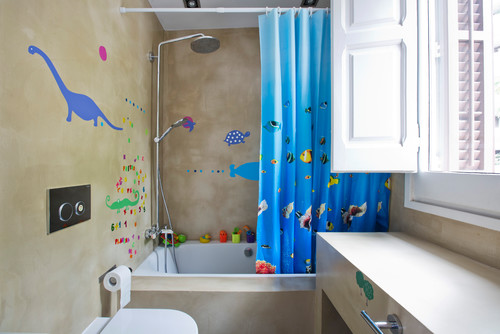 Brown earthy bathroom  walls with bright blue shower curtain and dinosaur wall stickers.