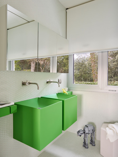 Green Wall-Mounted Sinks with White Penny Tile Backsplash