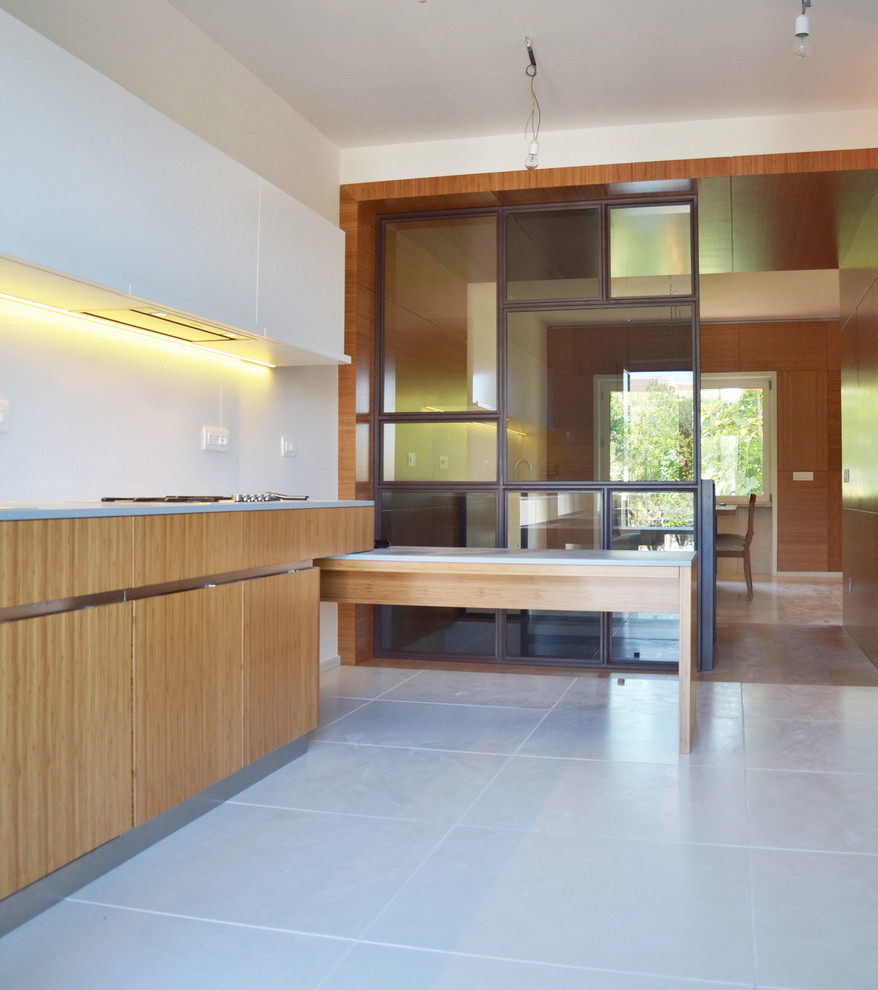 Large scandi galley enclosed kitchen in Rome with a built-in sink, flat-panel cabinets, light wood cabinets, concrete worktops, glass sheet splashback, white appliances, concrete flooring and white floors.