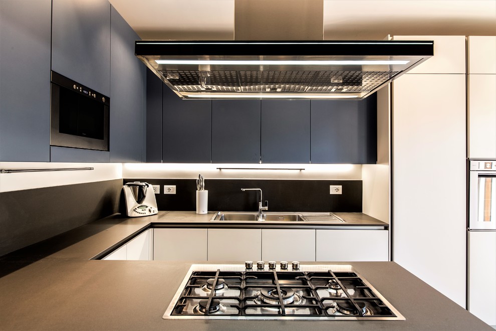 Medium sized contemporary u-shaped kitchen/diner in Rome with a built-in sink, beaded cabinets, white cabinets, composite countertops, blue splashback, stainless steel appliances, porcelain flooring, an island, brown floors and blue worktops.