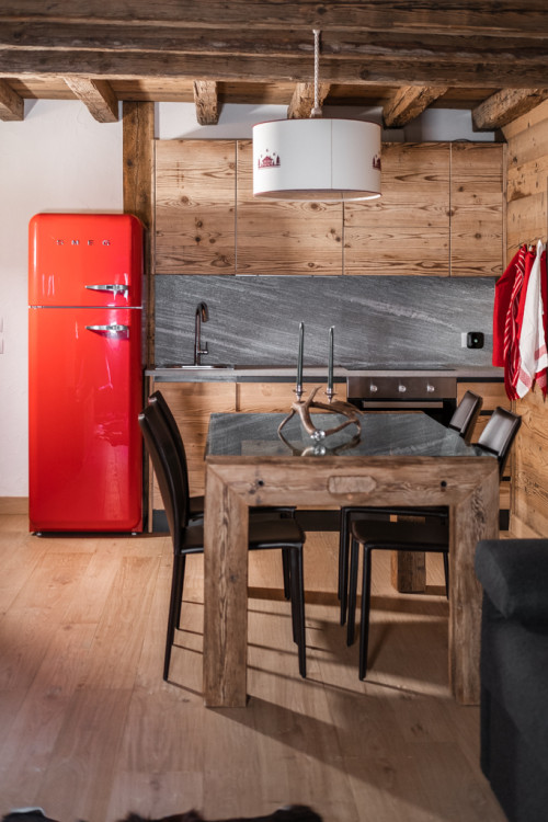 Gray Backsplash and Red Fridge in Natural Wood Cabinets - Timeless Retro Kitchen Ideas