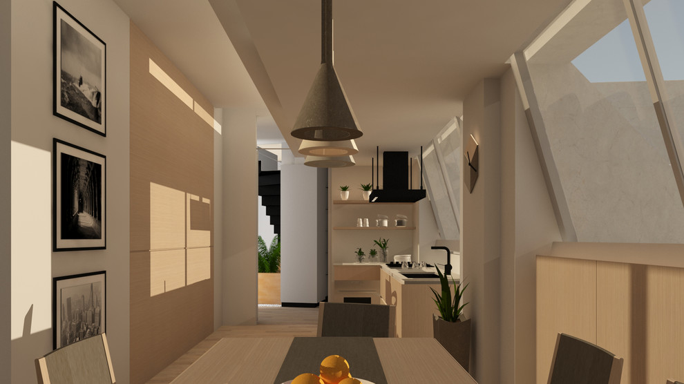Imagen de cocina comedor minimalista con puertas de armario de madera clara, encimera de cuarcita y suelo de madera clara