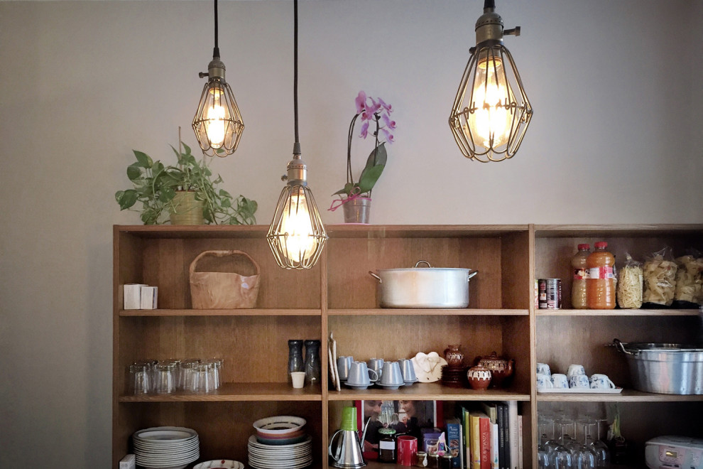 Inspiration for a medium sized traditional single-wall enclosed kitchen in Rome with a built-in sink, open cabinets, dark wood cabinets, marble worktops, white splashback, porcelain splashback, stainless steel appliances, cement flooring, grey floors and grey worktops.