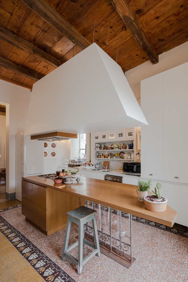Inspiration for a mid-sized eclectic l-shaped marble floor and multicolored floor open concept kitchen remodel in Other with flat-panel cabinets, white cabinets, marble countertops, gray backsplash, marble backsplash, an island, a double-bowl sink and white appliances