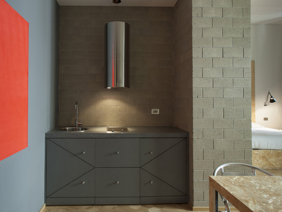 Стильный дизайн: прямая кухня-гостиная в современном стиле с серыми фасадами и столешницей из акрилового камня - последний тренд