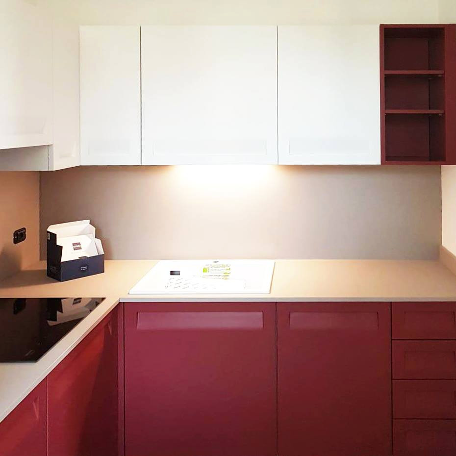 Small minimalist l-shaped enclosed kitchen photo in Milan with a drop-in sink, flat-panel cabinets, pink cabinets, laminate countertops, beige backsplash, no island and beige countertops