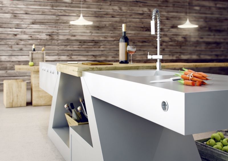 Imagen de cocina contemporánea pequeña con fregadero integrado, puertas de armario en acero inoxidable y encimera de acero inoxidable