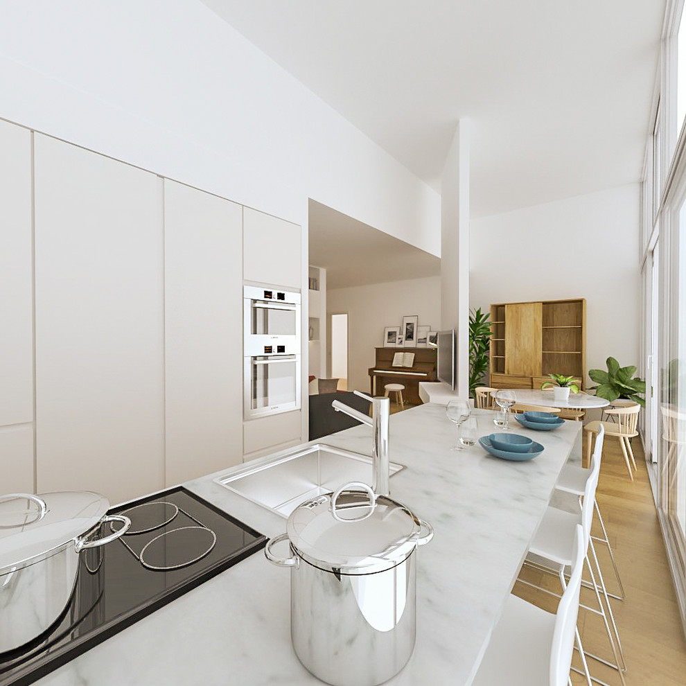 Photo of a small contemporary galley open plan kitchen in Milan with a built-in sink, flat-panel cabinets, white cabinets, marble worktops, white splashback, marble splashback, stainless steel appliances, light hardwood flooring and an island.